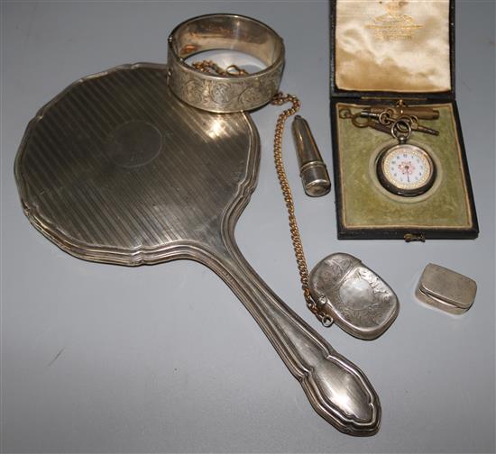 A silver bodkin case, a silver hand mirror, two boxes, a silver bangle and a fob watch.